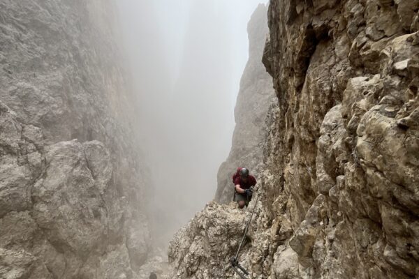Rosengarten Dolomites -Santnerpass Via Ferrata - climber on the route